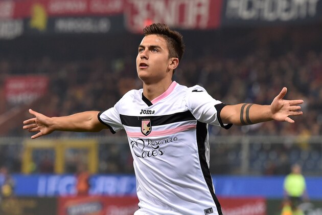 GENOA, ITALY - NOVEMBER 24:  Paulo Dybala of US Citta di Palermo celebrates after scoring the opening goal during the Serie A match between Genoa CFC and US Citta di Palermo at Stadio Luigi Ferraris on November 24, 2014 in Genoa, Italy.  (Photo by Valerio Pennicino/Getty Images)