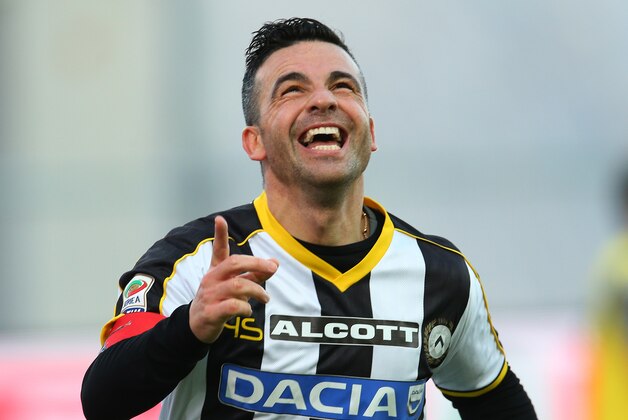 Udinese's Antonio Di Natale, celebrates after scoring during the Serie A soccer match between Udinese and Chievo at the Friuli Stadium in Udine, Italy, Sunday, Nov. 23, 2014. (AP Photo/Paolo Giovannini)