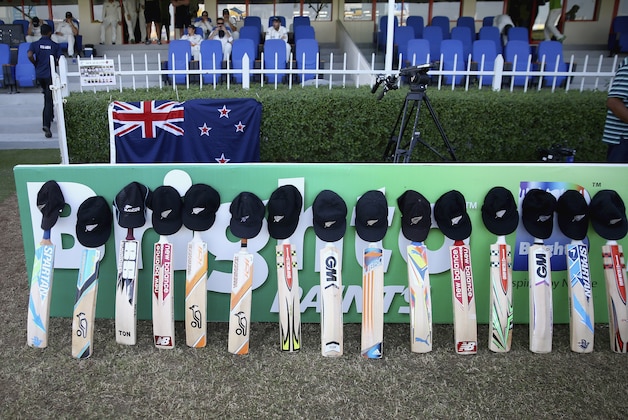 SHARJAH, UNITED ARAB EMIRATES - NOVEMBER 28:  Bats and caps are placed outside the New Zealand dressing room in memory of Australian cricketer Phillip Hughes who died as a result of head injuries sustained during the Sheffield Shield match between South Australia and New South Wales at the SCG on Tuesday, as a result of head injuries  during day two of the third test between Pakistan and New Zealand at Sharjah Stadium on November 28, 2014 in Sharjah, United Arab Emirates.  (Photo by Francois Nel/Getty Images)