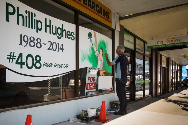 SYDNEY, AUSTRALIA - NOVEMBER 28:  A portrait is painted on a store display in memory of Australian cricketer Phillip Hughes on November 28, 2014 in Phillip Hughes' hometown Macksville, Australia. Cricket player Phil Hughes passed away aged 25, as a result of head injuries sustained during the Sheffield Shield match between South Australia and New South Wales at the SCG on Tuesday.  (Photo by Joosep Martinson/Getty Images)