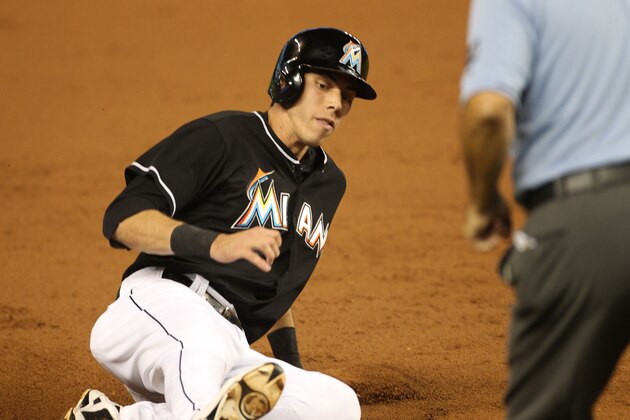 MIAMI, FL - SEPTEMBER 25: Christian Yelich #21 of the Miami Marlins slides into third base during the first inning against the Philadelphia Phillies at Marlins Park on September 25, 2014 in Miami, Florida.  (Photo by Marc Serota/Getty Images)
