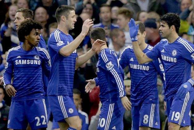 Chelsea's Diego Costa, right, celebrates scoring his side's first goal during the English Premier League soccer match between Chelsea and West Bromwich Albion at Stamford Bridge stadium in London, Saturday, Nov. 22, 2014.  (AP Photo/Matt Dunham)