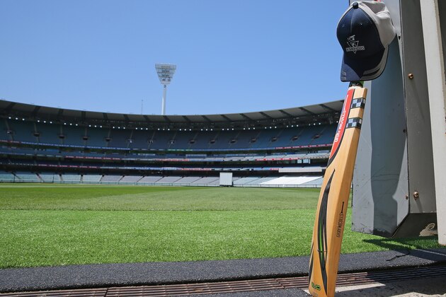MELBOURNE, AUSTRALIA - NOVEMBER 28:  A cricket bat and cap left by a Cricket Victoria player sits in the players tunnel at the Melbourne Cricket Ground as people remember Phillip Hughes by placing their bat and cricket cap out the front of their homes as a sign of respect on November 28, 2014 in Melbourne, Australia. Cricket player, Phil Hughes passed away aged 25, as a result of head injuries sustained during the Sheffield Shield match between South Australia and New South Wales at the SCG on Tuesday.  (Photo by Scott Barbour/Getty Images)
