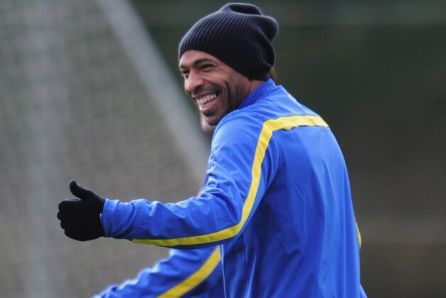 ST ALBANS, ENGLAND - NOVEMBER 25:  Former Arsenal player Thierry Henry warms up during a training session at London Colney on November 25, 2013 in St Albans, England.  (Photo by Shaun Botterill/Getty Images)