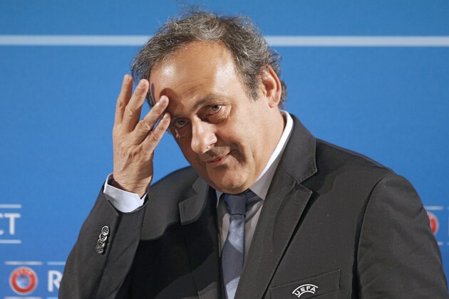 FILE - In this Feb.22, 2014 file photo, UEFA President Michel Platini arrives at a press conference, one day prior to the UEFA EURO 2016 qualifying draw in Nice, southeastern France. Michel Platini will not challenge Sepp Blatter for the FIFA presidency, saying Thursday Aug.28, 2014  there was