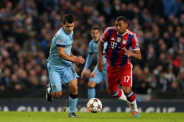 MANCHESTER, ENGLAND - NOVEMBER 25:  Sergio Aguero of Manchester City is pursued by Jerome Boateng of Bayern Muenchen during the UEFA Champions League Group E match between Manchester City and FC Bayern Muenchen at the Etihad Stadium on November 25, 2014 in Manchester, United Kingdom.  (Photo by Alex Livesey/Getty Images)
