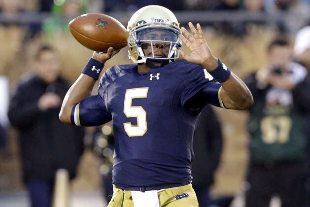Notre Dame quarterback Charlie Fiessinger looks to a pass during the first half of an NCAA college football game against Louisville in South Bend, Ind., Saturday, Nov. 22, 2014. (AP Photo/Nam Y. Huh)