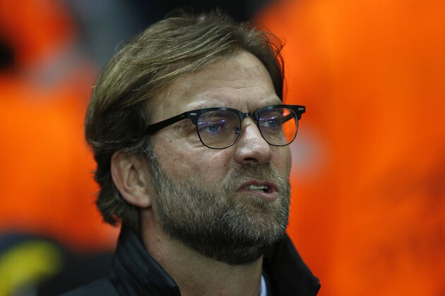 Dortmund's head coach Juergen Klopp watches the Champions League group D soccer match between Arsenal and Borussia Dortmund at the Emirates stadium in London, Wednesday, Nov. 26, 2014. (AP Photo/Alastair Grant)