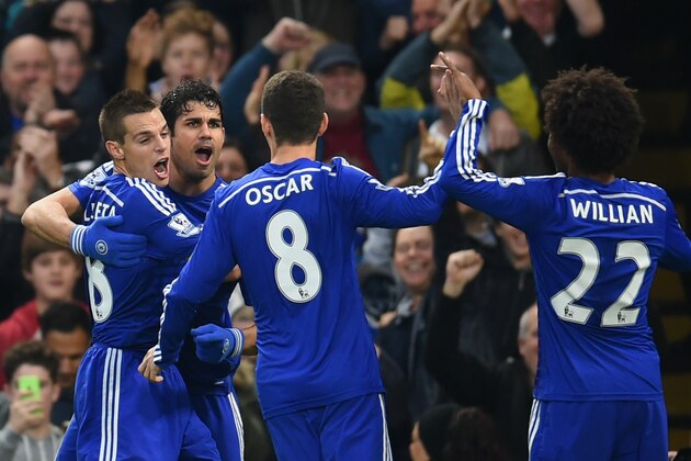 LONDON, ENGLAND - NOVEMBER 22:  Diego Costa of Chelsea celebrates scoring opening goal with team mates during the Barclays Premier League match between Chelsea and West Bromwich Albion at Stamford Bridge on November 22, 2014 in London, England.  (Photo by Tom Dulat/Getty Images)