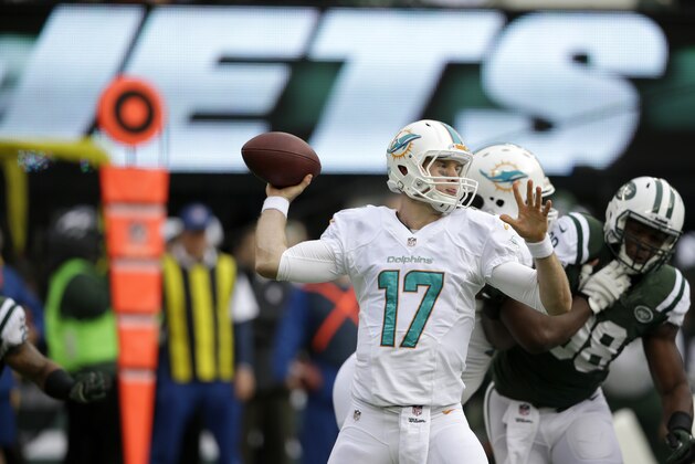 Miami Dolphins quarterback Ryan Tannehill throws a pass against the New York Jets during the first half of an NFL football game, Sunday, Dec. 1, 2013, in East Rutherford, N.J. (AP Photo/Seth Wenig)