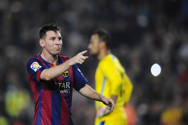 FC Barcelona's Lionel Messi, from Argentina, celebrates after scoring against Sevilla during a Spanish La Liga soccer match between FC Barcelona and Sevilla,  at the Camp Nou stadium in Barcelona, Spain, Saturday, Nov. 22, 2014. Messi, set a La Liga scoring record of 253 goals when he claimed a hat-trick in Saturday's match at the Camp Nou stadium against Sevilla. (AP Photo/Manu Fernandez)