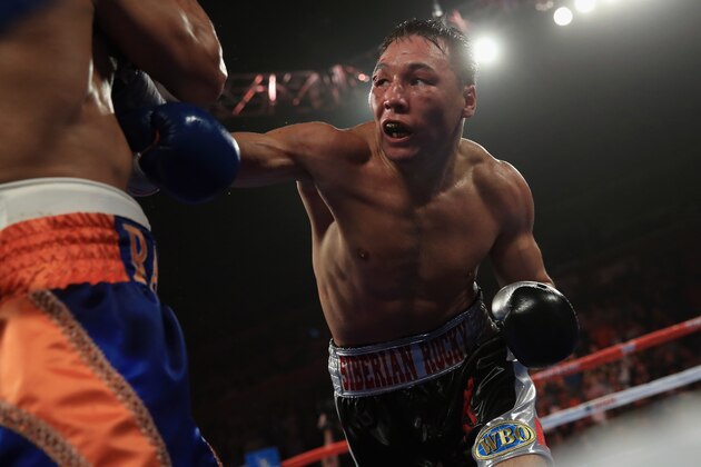 BROOMFIELD, CO - OCTOBER 19:  Ruslan Provodnikov of Russia delivers a punch to Mike Alvarado as Provodnikov won their bout with a TKO in the 10th round to claim the WBO Junior Welterweight Title at the 1stBank Center on October 19, 2013 in Broomfield, Colorado.  (Photo by Doug Pensinger/Getty Images)