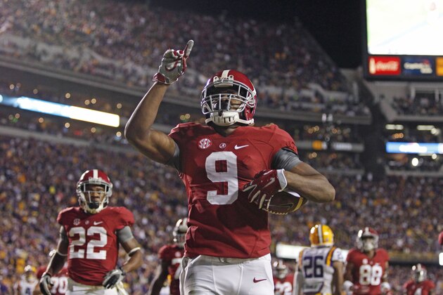 Alabama wide receiver Amari Cooper (9) celebrates his 23 yard touchdown reception in the first half of an NCAA college football game against LSU in Baton Rouge, La., Saturday, Nov. 8, 2014. (AP Photo/Jonathan Bachman)