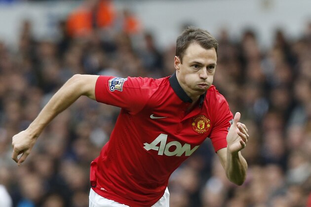 Manchester United's Jonny Evans plays against Tottenham Hotspur during their English Premier League soccer match at White Hart Lane, London, Sunday, Dec. 1, 2013. (AP Photo/Sang Tan)