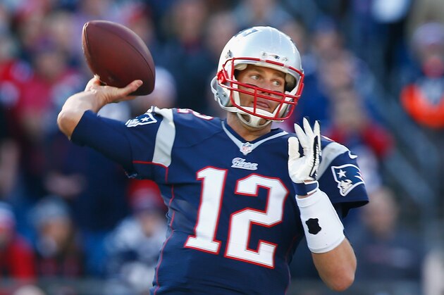 FOXBORO, MA - NOVEMBER 23:  Tom Brady #12 of the New England Patriots passes the ball during the first quarter against the Detroit Lions at Gillette Stadium on November 23, 2014 in Foxboro, Massachusetts.  (Photo by Jared Wickerham/Getty Images)