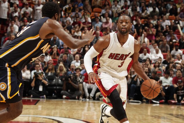 MIAMI, FL - November 12:  Dwyane Wade #3 of the Miami Heat handles the ball against the Indiana Pacers at the American Airlines Arena in Miami, Florida on November 12, 2014. NOTE TO USER: User expressly acknowledges and agrees that, by downloading and/or using this photograph, user is consenting to the terms and conditions of the Getty Images License Agreement. Mandatory copyright notice: Copyright NBAE 2014 (Photo by Issac Baldizon/NBAE via Getty Images)