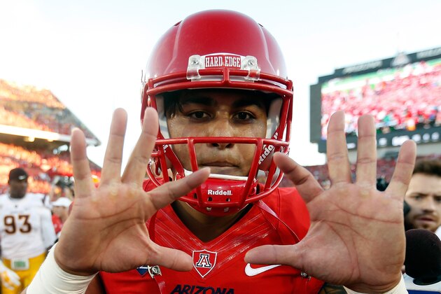 TUCSON, AZ - NOVEMBER 28:  Quarterback Anu Solomon #12 of the Arizona Wildcats celebrates after defeating the Arizona State Sun Devils 42-35 to win the PAC-12 south championship following the Territorial Cup college football game at Arizona Stadium on November 28, 2014 in Tucson, Arizona.  (Photo by Christian Petersen/Getty Images)