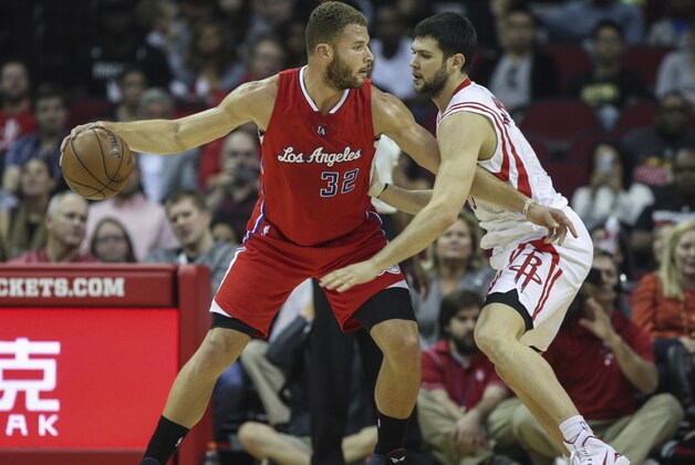 Nov 28, 2014; Houston, TX, USA; Los Angeles Clippers forward Blake Griffin (32) controls the ball during the first quarter as Houston Rockets forward Kostas Papanikolaou (16) defends at Toyota Center. Mandatory Credit: Troy Taormina-USA TODAY Sports