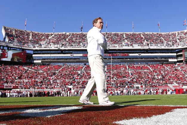 Alabama head coach Nick Saban walks around during warmups before an NCAA college football game between Alabama and Mississippi State on Saturday, Nov. 15, 2014, in Tuscaloosa, Ala. (AP Photo/Butch Dill)