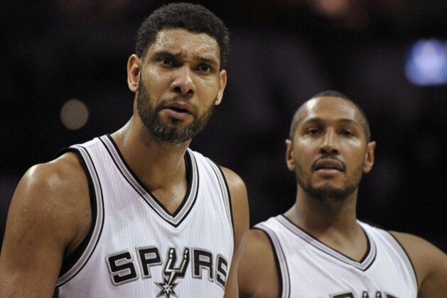San Antonio Spurs forwards Tim Duncan, left, and Boris Diaw, of France, react to a call during the second half of an NBA basketball game against the Indiana Pacers, Wednesday, Nov. 26, 2014, in San Antonio. San Antonio won 106-100. (AP Photo/Darren Abate)