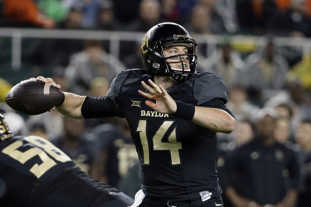 Baylor quarterback Bryce Petty (14) passes from the pocket in the first half of an NCAA college football game against Oklahoma State, Saturday, Nov. 22, 2014, in Waco, Texas. (AP Photo/Tony Gutierrez)