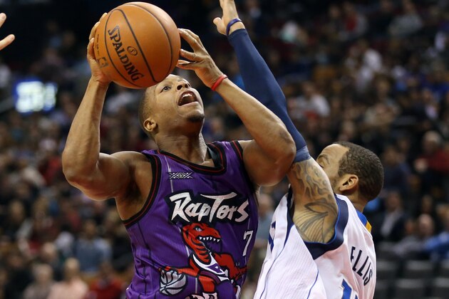 Nov 28, 2014; Toronto, Ontario, CAN; Toronto Raptors point guard Kyle Lowry (7) goes to the basket against Dallas Mavericks guard Monta Ellis (11) at Air Canada Centre. The Mavericks beat the Raptors 106-102. Mandatory Credit: Tom Szczerbowski-USA TODAY Sports