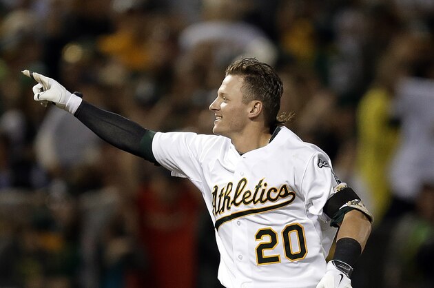 Oakland Athletics' Josh Donaldson celebrates after hitting the game-winning three-run home run off Baltimore Orioles' Zach Britton in the ninth inning of a baseball game Friday, July 18, 2014, in Oakland, Calif. Oakland won 5-4. (AP Photo/Ben Margot)