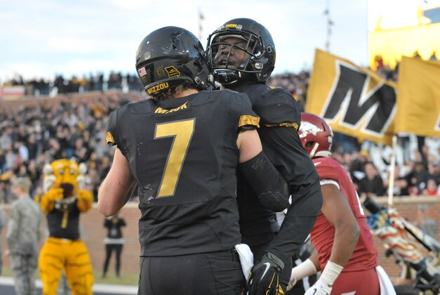 Nov 28, 2014; Columbia, MO, USA; Missouri Tigers wide receiver Darius White (8) is congratulated by quarterback Maty Mauk (7) after White's two point conversion catch during the second half against the Arkansas Razorbacks at Faurot Field. Missouri won 21-14. Mandatory Credit: Denny Medley-USA TODAY Sports