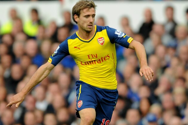 Arsenal's Nacho Monreal during the English Premier League soccer match between Everton and Arsenal at Goodison Park, in Liverpool, England, Saturday, Aug 23, 2014.  (AP Photo/Rui Vieira)