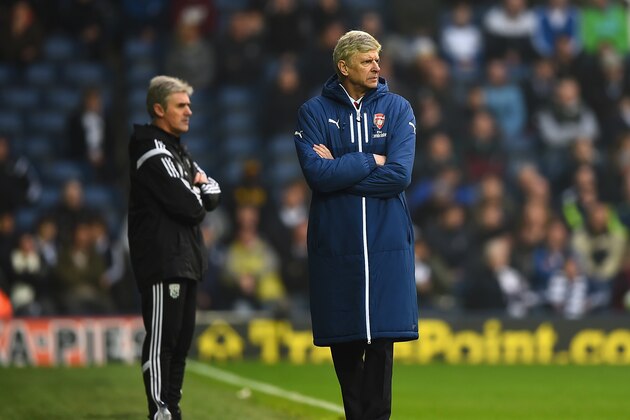 WEST BROMWICH, ENGLAND - NOVEMBER 29:  Arsene Wenger, manager of Arsenal and Manager Alan Irvine of West Brom look on from the touchline during the Barclays Premier League match between West Bromwich Albion and Arsenal at The Hawthorns on November 29, 2014 in West Bromwich, England.  (Photo by Laurence Griffiths/Getty Images)