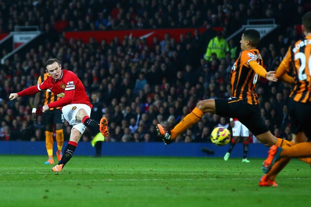 MANCHESTER, ENGLAND - NOVEMBER 29:  Wayne Rooney of Manchester United scores their second goal during the Barclays Premier League match between Manchester United and Hull City at Old Trafford on November 29, 2014 in Manchester, England.  (Photo by Matthew Lewis/Getty Images)