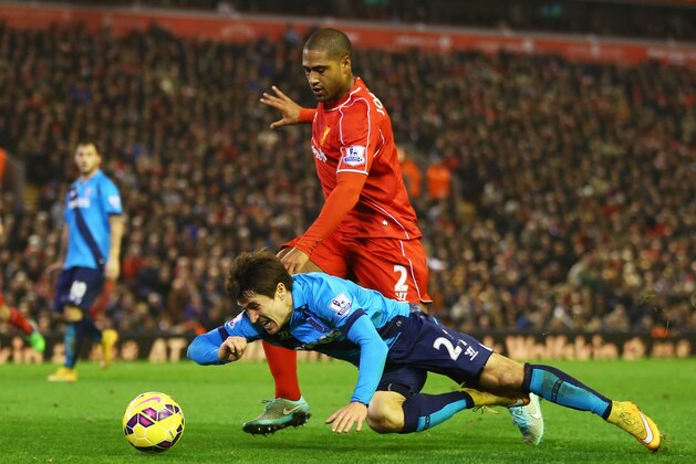 LIVERPOOL, ENGLAND - NOVEMBER 29:  Glen Johnson of Liverpool challenges Bojan Krkic of Stoke City during the Barclays Premier League match between Liverpool and Stoke City at Anfield on November 29, 2014 in Liverpool, England.  (Photo by Richard Heathcote/Getty Images)