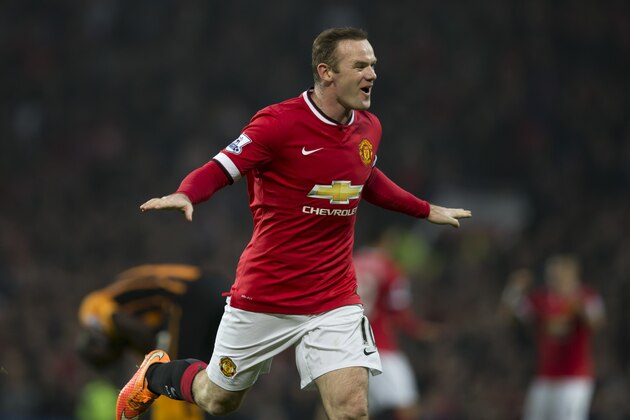 Manchester United's Wayne Rooney celebrates after scoring during the English Premier League soccer match between Manchester United and Hull City at Old Trafford Stadium, Manchester, England, Saturday Nov. 29, 2014. (AP Photo/Jon Super)