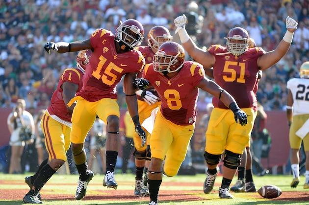 LOS ANGELES, CA - NOVEMBER 29:  Nelson Agholor #15 of the USC Trojans celebrates his touchdown with George Farmer #8 to take a 35-0 lead over the Notre Dame Fighting Irish at Los Angeles Memorial Coliseum on November 29, 2014 in Los Angeles, California.  (Photo by Harry How/Getty Images)
