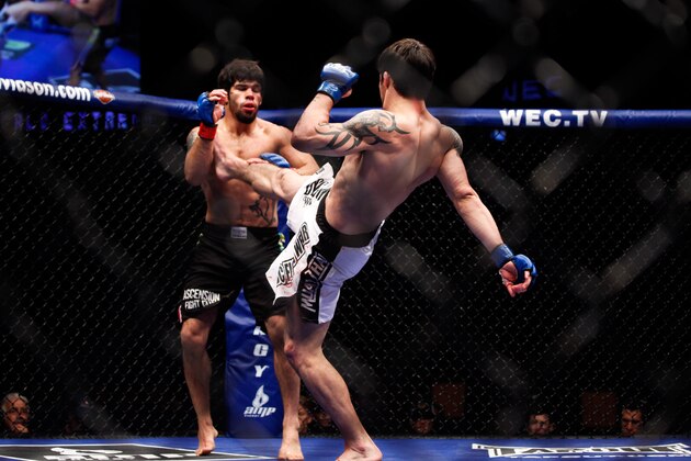 Diego Nunes fights Rapheal Assuncao  during their WEC 49 mixed martial arts match Sunday, June 20, 2010 at the Rexall Palace in Edmonton, Alberta, Canada.  Diego Nunes won by split decision. (AP Photo / Phillip Chin)