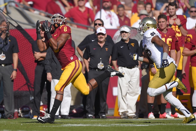 Southern California wide receiver George Farmer, left, makes a touchdown catch as Notre Dame cornerback Cole Luke defends during the first half of an NCAA college football game, Saturday, Nov. 29, 2014, in Los Angeles. (AP Photo/Mark J. Terrill)