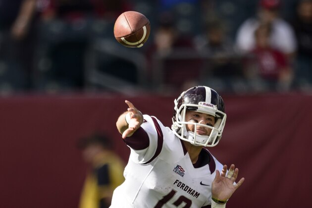 Sep 14, 2013; Philadelphia, PA, USA; Fordham Rams quarterback Michael Nebrich (12) passes the ball during the fourth quarter against the Temple Owls at Lincoln Financial Field. Fordham defeated Temple 30-29. Mandatory Credit: Howard Smith-USA TODAY Sports
