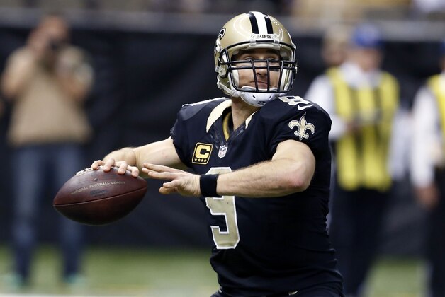 New Orleans Saints quarterback Drew Brees (9) passes in the first half of an NFL football game against the Baltimore Ravens in New Orleans, Monday, Nov. 24, 2014. (AP Photo/Jonathan Bachman)