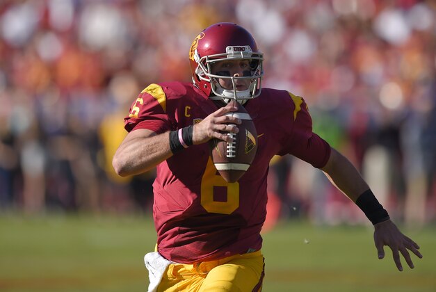 Southern California quarterback Cody Kessler runs the ball during the first half of an NCAA college football game against Notre Dame, Saturday, Nov. 29, 2014, in Los Angeles. (AP Photo/Mark J. Terrill)