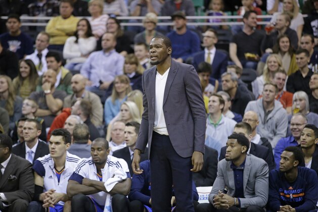 Oklahoma City Thunder's Kevin Durant watches during the second half of the Thunder's NBA basketball game against the Utah Jazz on Tuesday, Nov. 18, 2014, in Salt Lake City. The Jazz won 98-81. (AP Photo/Rick Bowmer)