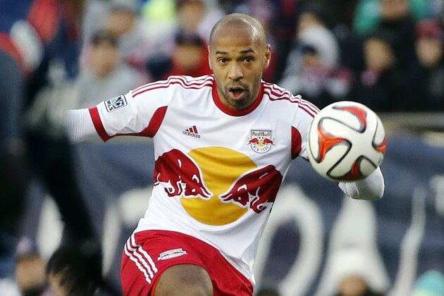 New York Red Bulls forward Thierry Henry handles the ball against the New England Revolution during the first half of the second soccer game of the MLS Eastern Conference final in Foxborough, Mass., Saturday, Nov. 29, 2014. The match ended 2-2 and New England advances with a two-game aggregate 4-3. (AP Photo/Elise Amendola)