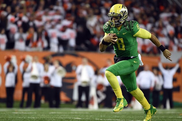 CORVALLIS, OR - NOVEMBER 29:  Quarterback Marcus Mariota #8 of the Oregon Ducks runs with the ball during the first quarter of the game against the Oregon State Beavers at Reser Stadium on November 29, 2014 in Corvallis, Oregon.  (Photo by Steve Dykes/Getty Images)