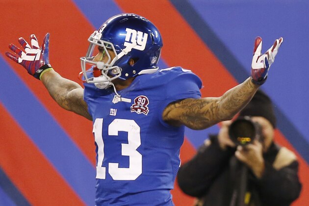 New York Giants wide receiver Odell Beckham Jr. (13) reacts after making a one-handed catch for a touchdown against the Dallas Cowboys in the first quarter of an NFL football game, Sunday, Nov. 23, 2014, in East Rutherford, N.J. (AP Photo/Kathy Willens)