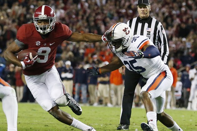 Alabama wide receiver Amari Cooper (9) moves against Auburn defensive back Joe Turner (35) during the second half of the Iron Bowl NCAA college football game, Saturday, Nov. 29, 2014, in Tuscaloosa, Ala. (AP Photo/Brynn Anderson)
