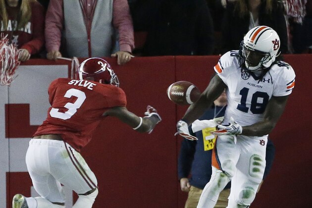 Auburn wide receiver Sammie Coates (18) tries to make the catch against Alabama defensive back Bradley Sylve (3) during the second half of the Iron Bowl NCAA college football game, Saturday, Nov. 29, 2014, in Tuscaloosa, Ala. (AP Photo/Brynn Anderson)