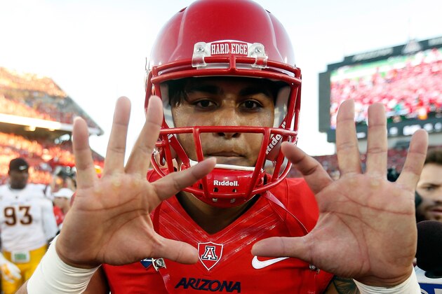 TUCSON, AZ - NOVEMBER 28:  Quarterback Anu Solomon #12 of the Arizona Wildcats celebrates after defeating the Arizona State Sun Devils 42-35 to win the PAC-12 south championship following the Territorial Cup college football game at Arizona Stadium on November 28, 2014 in Tucson, Arizona.  (Photo by Christian Petersen/Getty Images)
