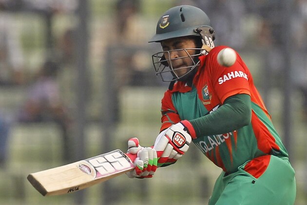 Bangladesh’s Mushfiqur Rahim plays a shot during the fourth one-day international cricket match against Zimbabwe in Dhaka, Bangladesh, Friday, Nov. 28, 2014. (AP Photo/A.M. Ahad)