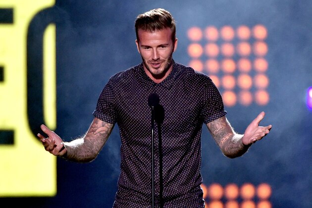 LOS ANGELES, CA - JULY 17:  Soccer player David Beckham accepts the Legend Award onstage during Nickelodeon Kids' Choice Sports Awards 2014 at UCLA's Pauley Pavilion on July 17, 2014 in Los Angeles, California.  (Photo by Kevin Winter/Getty Images)