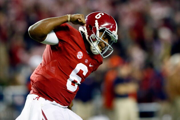 TUSCALOOSA, AL - NOVEMBER 29:  Blake Sims #6 of the Alabama Crimson Tide celebrates throwing a touchdown in the fourth quarter against the Auburn Tigers during the Iron Bowl at Bryant-Denny Stadium on November 29, 2014 in Tuscaloosa, Alabama.  (Photo by Kevin C. Cox/Getty Images)