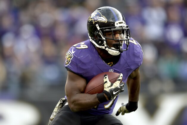 FILE - In this Nov. 9, 2014, file photo, Baltimore Ravens running back Justin Forsett (29) carries the ball during the second half of an NFL football game against the Tennessee Titans in Baltimore. Across the NFL, while many superstars are doing their thing, a wide range of obscure players are having a major impact.   Not just on the offensive line, where anonymity is a given, but even at high-profile positions such as linebacker and running back. Step up and take a bow Justin Forsett, Chris Borland and Connor Barwin. (AP Photo/Gail Burton, File)